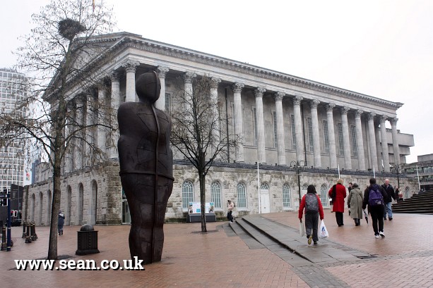 Photo of Birmingham Town Hall with Antony Gormley statue in Birmingham, UK