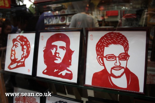 Photo of Chinese papercuts, including Edward Snowden in China