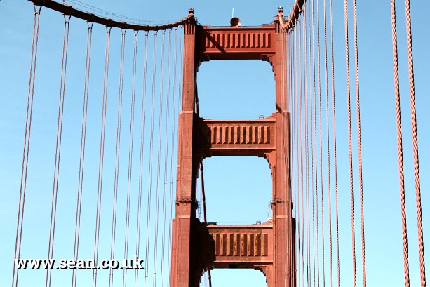 Photo of a tower and cables on the Golden Gate Bridge in San Francisco, USA