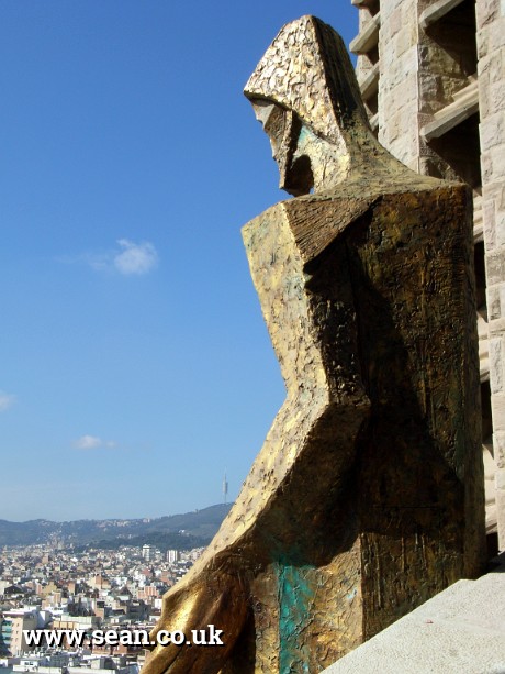 Photo of bronze Jesus figure on Sagrada Familia in Spain