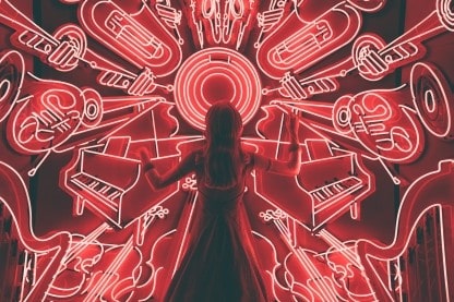 Photo of woman appearing to conduct an orchestra or instruments made of neon lights