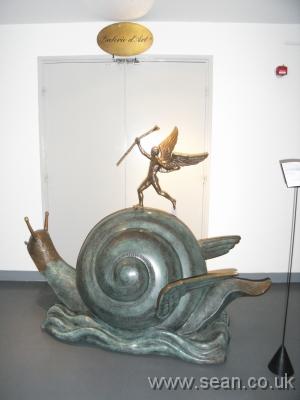 snail sculpture shown blocking the gallery doors