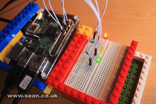 Photo of my Raspberry Pi and breadboard, joined together with Lego