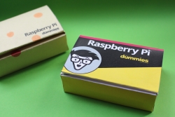 Photo of two paper Raspberry Pi cases