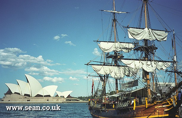 Photo of a tall ship in front of the Sydney Opera House in Australia
