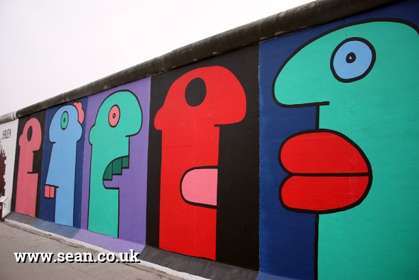 Photo of paintings by Thierry Noir on The Berlin Wall in Berlin, Germany