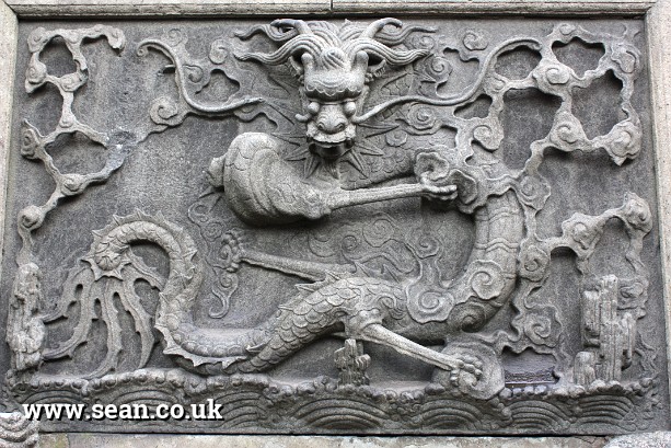 Photo of a dragon carving in the Yu Gardens in China