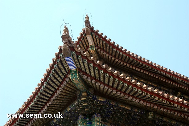 Photo of an ornate roof in the Forbidden City in China