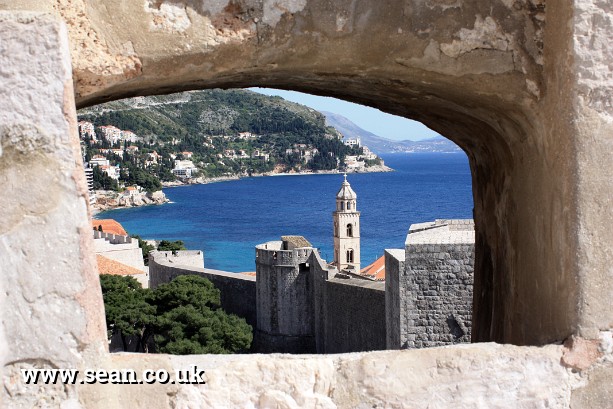 Photo of a view through the city wall in Dubrovnik