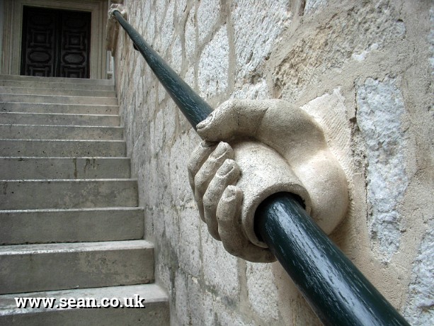 Photo of hands on the banister in Dubrovnik