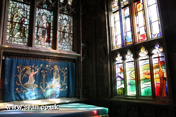Photo of the stained glass windows in Gloucester Cathedral in England