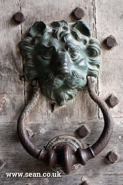 Photo of a lion's head doorknocker in England