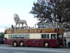 a stone lion on a tourist bus