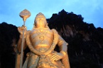 the Murugan statue illuminated