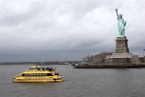 the Statue of Liberty and a New York water taxi