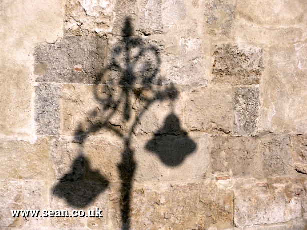 Photo of a shadow of street lights in Spain