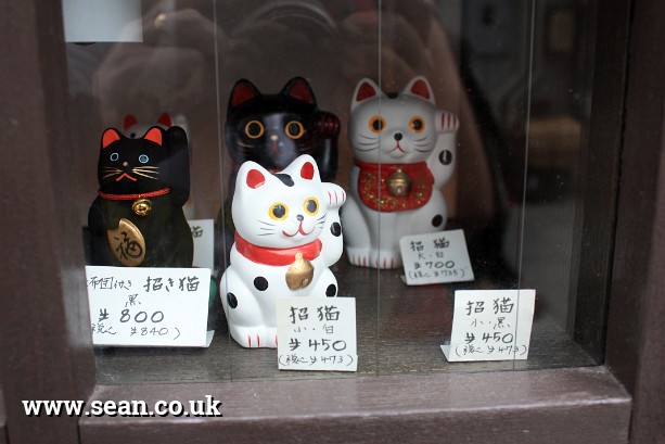 Photo of lucky cats in Japan in Tokyo, Japan