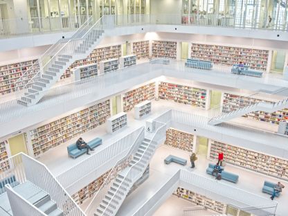 A photo of a beautiful multi-floor library, viewed from inside